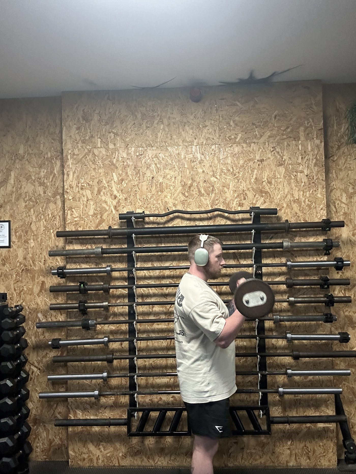 Emmet training a client on the cable machine at Crawford Fitness, Derry